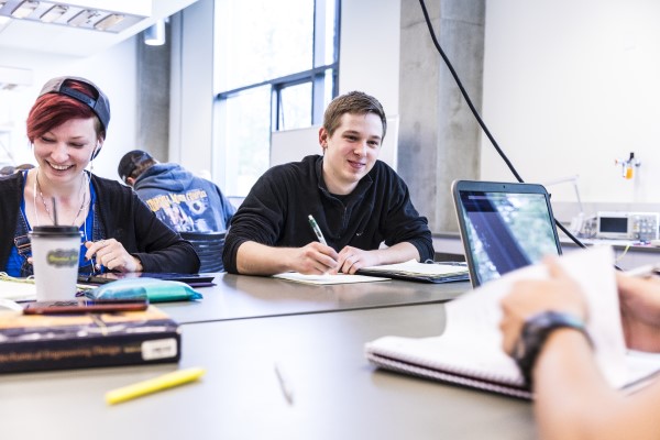 Students sitting across from each other in class