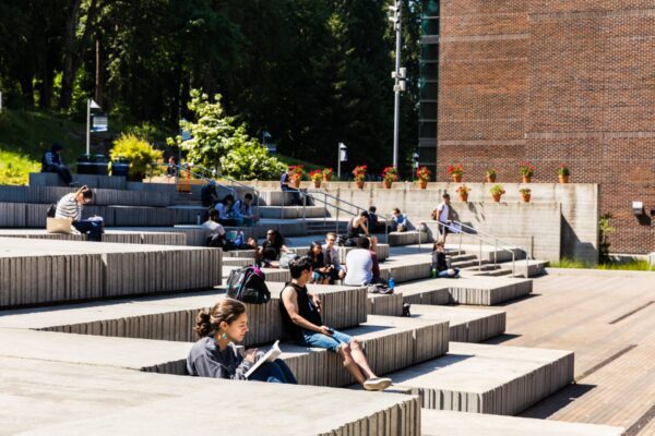 People sitting in the promenade area.