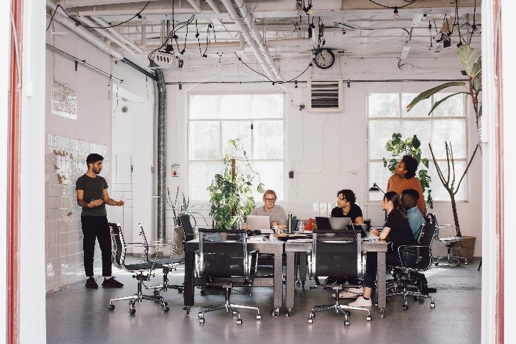 An image of a professional team working together at a table