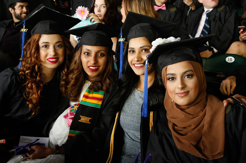 Students dressed in graduation regalia