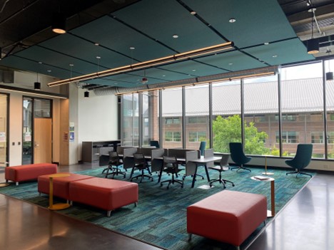 A collaboration lounge in Innovation Hall, with partial carpeting and sound insulation panels above. 