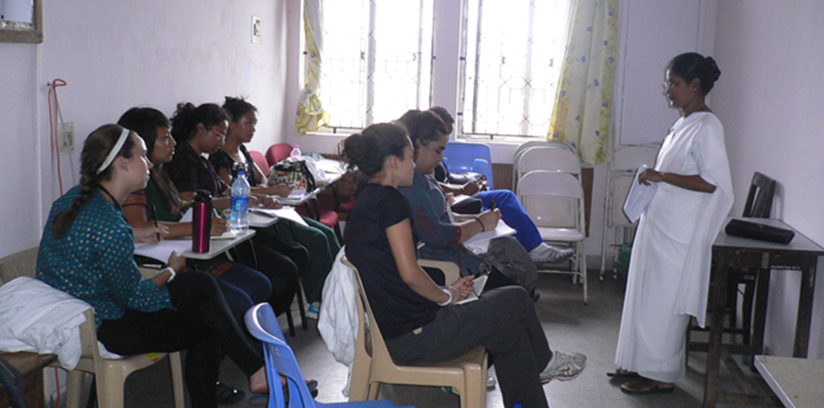 Students learning in small classroom in India