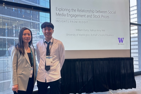 William Uyeta and his mentor, Dr. Xiahua Anny Wei, at the INFORMS Annual Conference