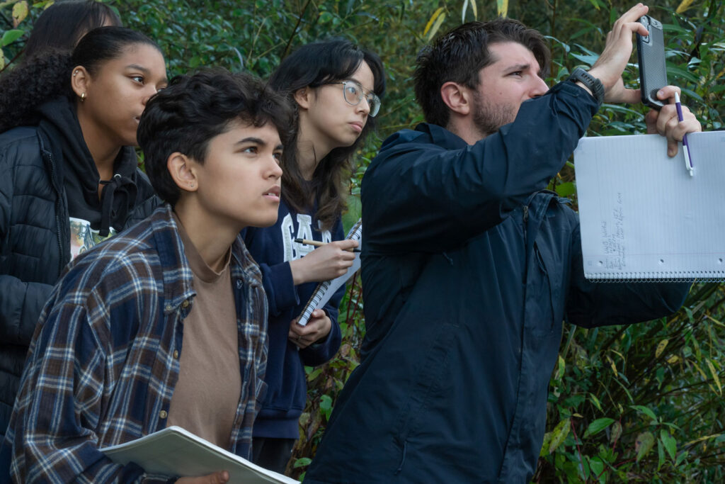 A group of people looking at something.