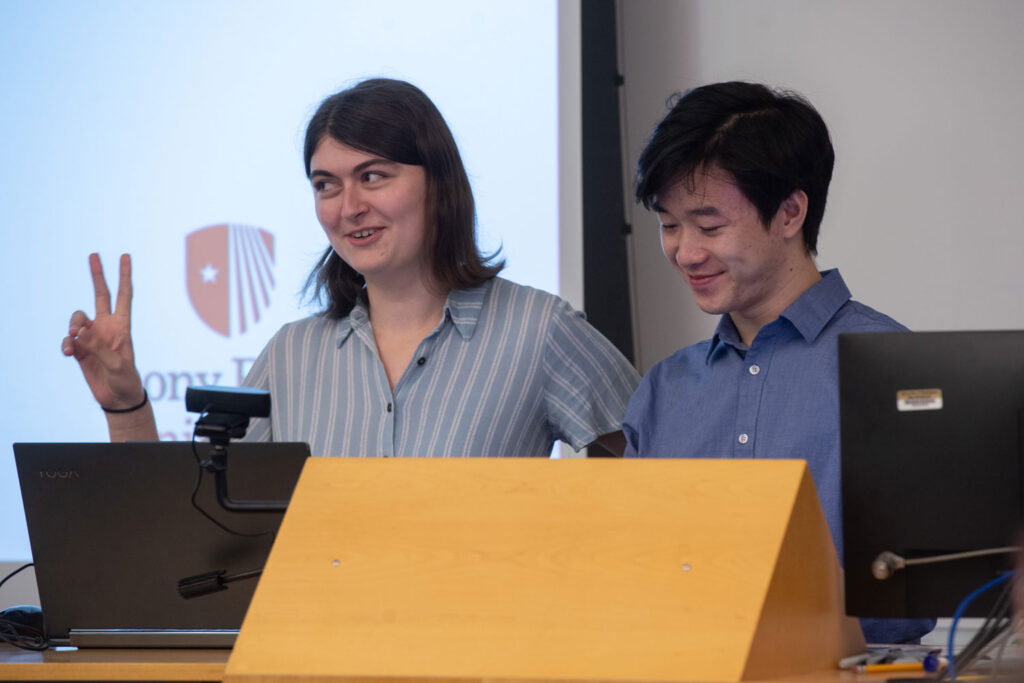 Two people behind a podium.