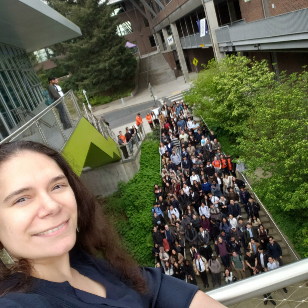 A person with a crowd of people behind them.