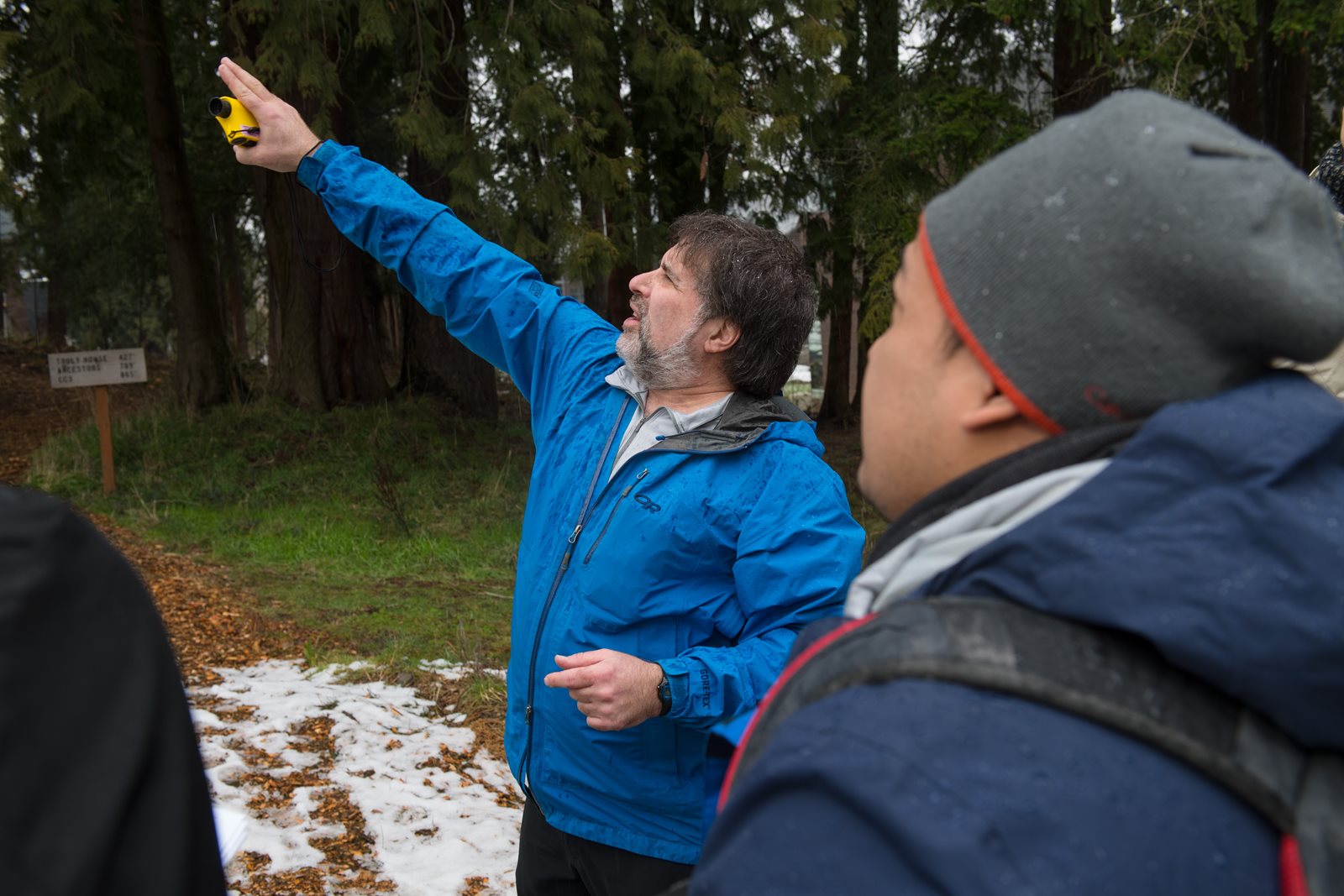 Warren Gold pointing at tree canopy