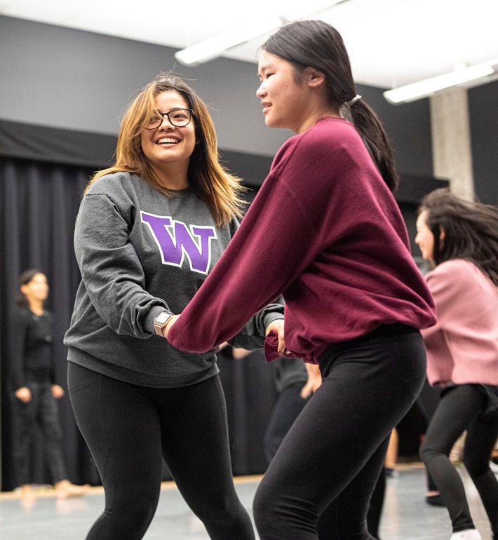 Pair of students dancing.