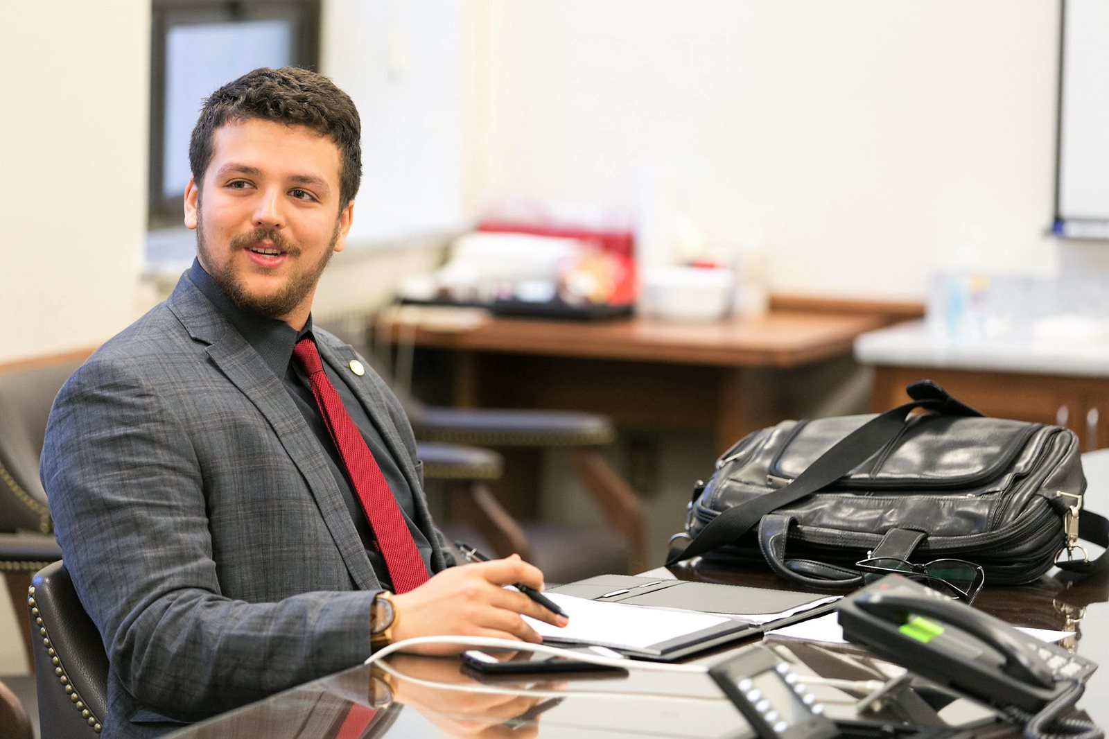 Avi Socha working at desk