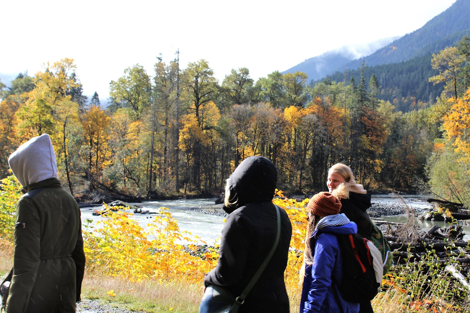 Students hike along river