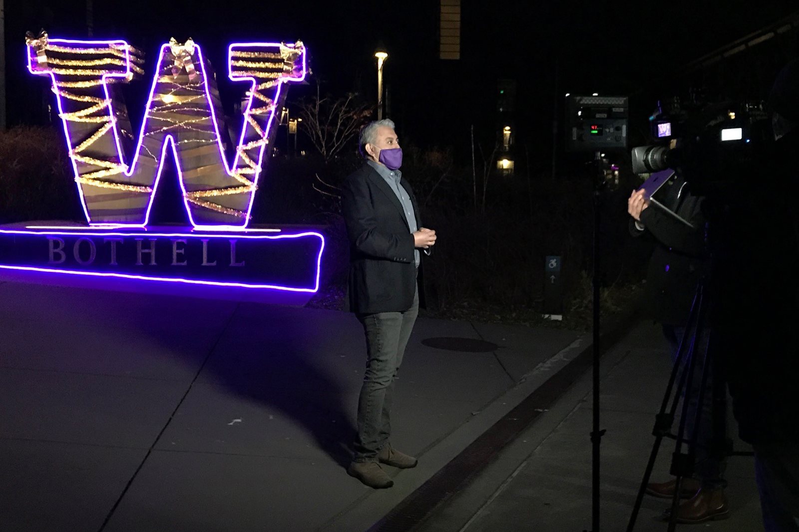 Dan Bustillos being filmed on campus after dark