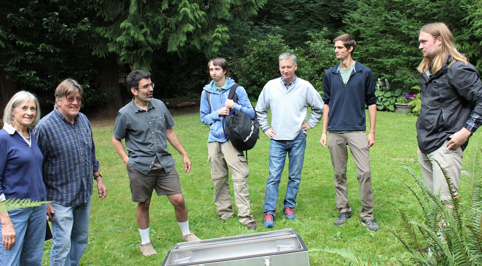 Homeowners, faculty and students in backyard