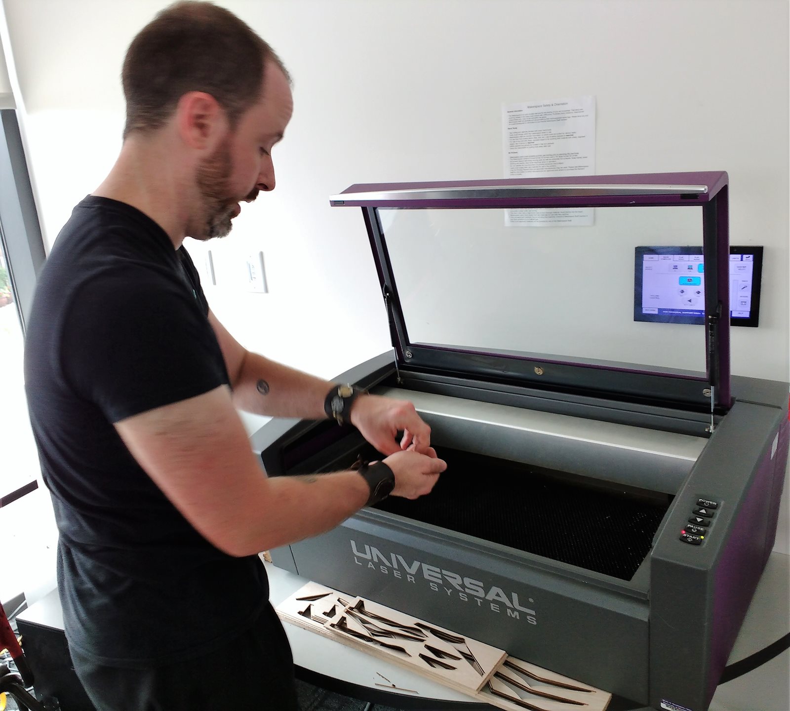 Ivan Owen using laser cutter