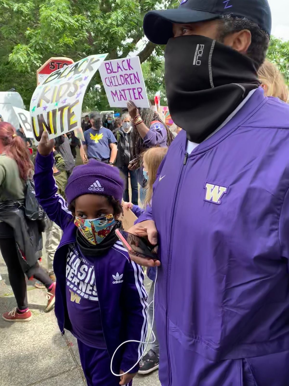 Johnson with son, Roman, at march for Black lives