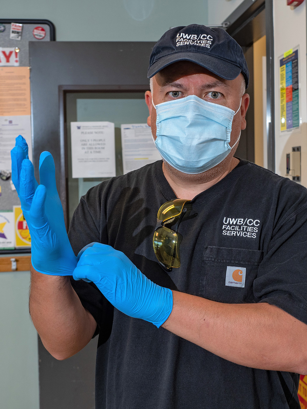 Anibal wearing a mask and gloves