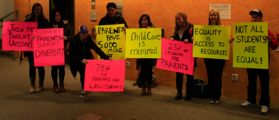 students holding protest signs 2