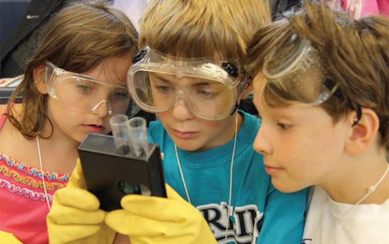 girls at science exhibit